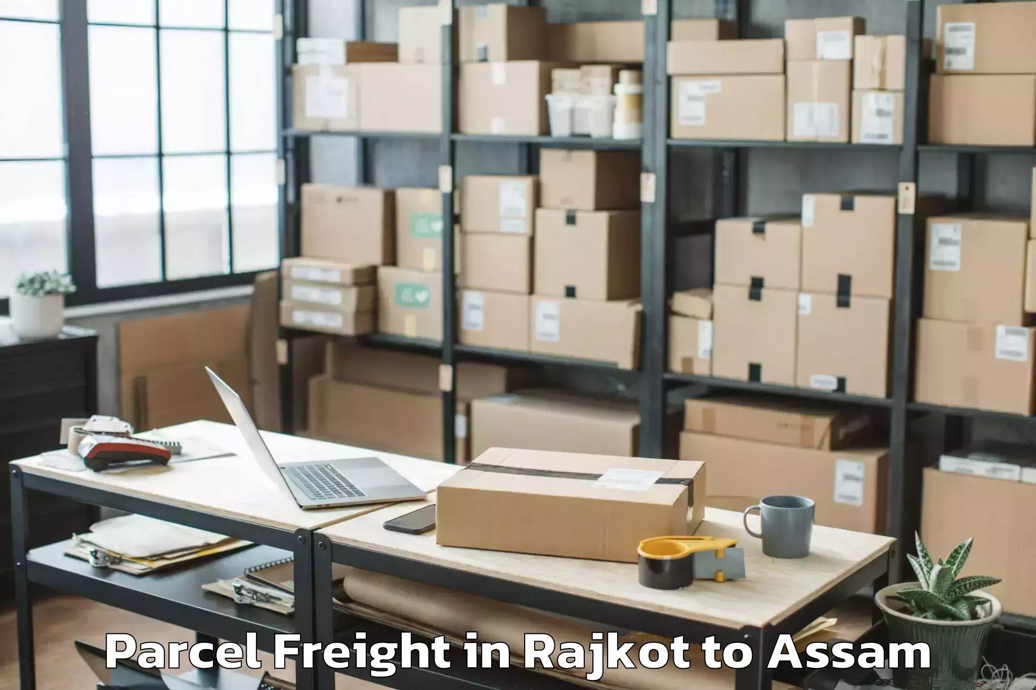 Book Rajkot to Baganpara Pt Parcel Freight Online